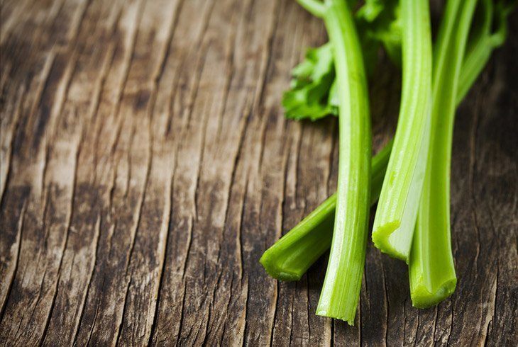 Celery-stalks-on-wooden-board-how-long-does-celery-last