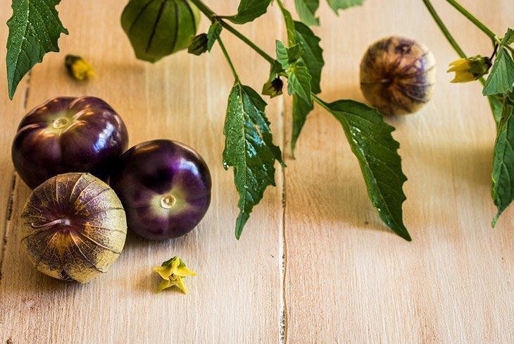Purple-tomatillos-on-cutting-board-how-to-store-tomatillos