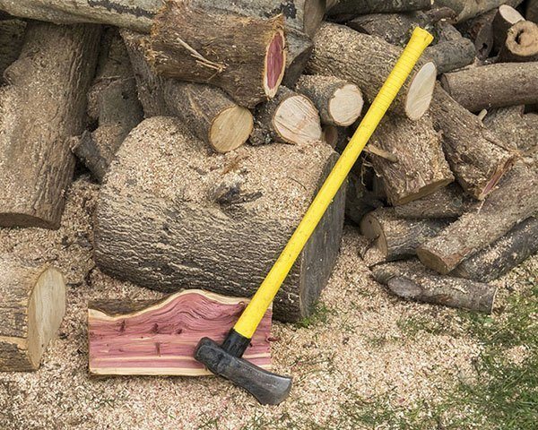 Splitting maul along with woods on the ground